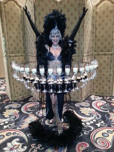 woman in costume serving champagne